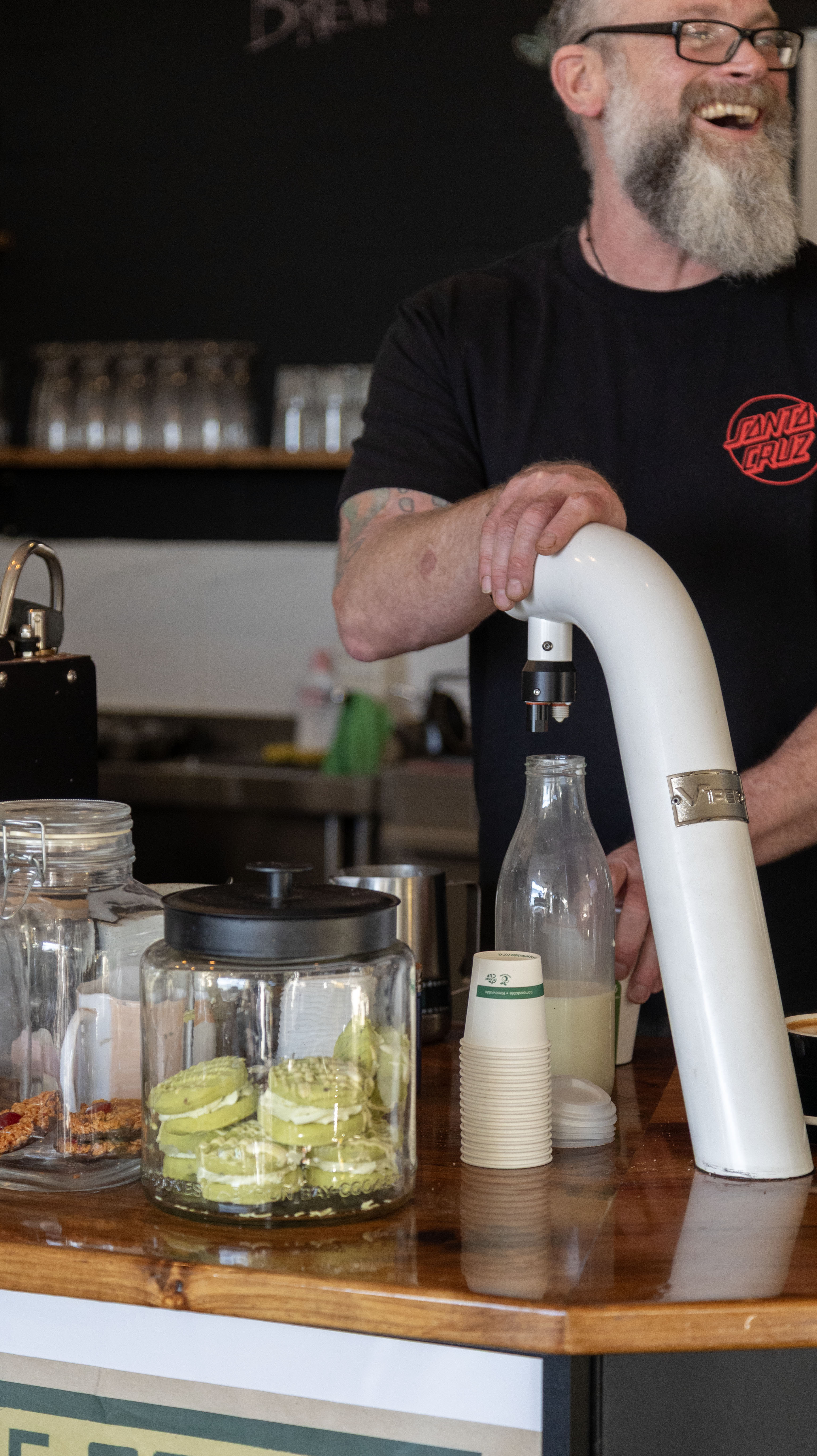 Barista dispensing fresh milk from a TUW tap
